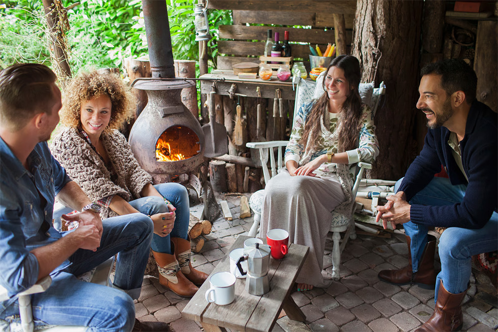 people around chiminea fire pit