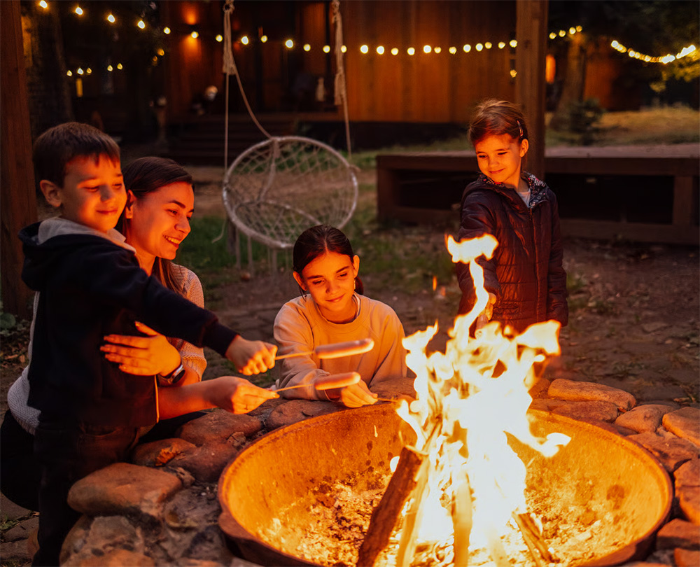 Classic fire pit with kids toasting marshmellows